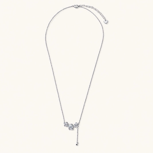 White gold plated Y-shaped necklace with three dimensional flower charms and adjustable drop pendant