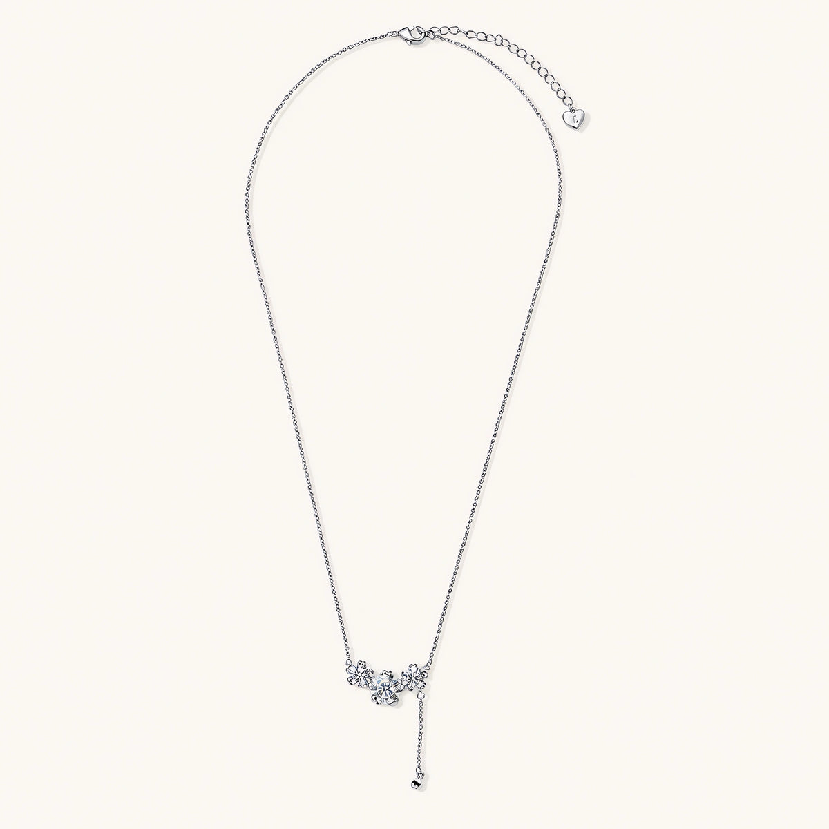 White gold plated Y-shaped necklace with three dimensional flower charms and adjustable drop pendant