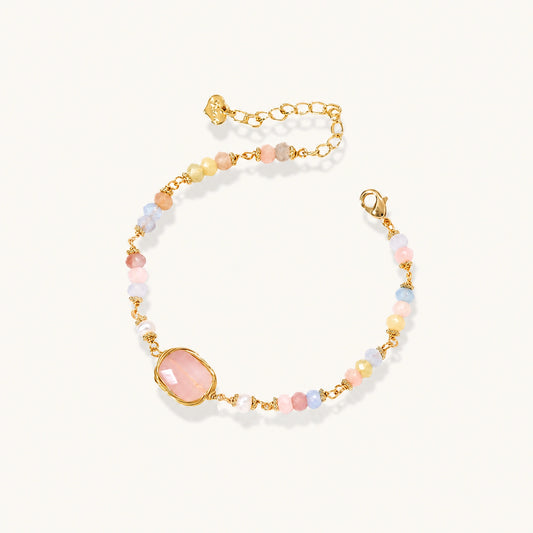 Delicate beaded bracelet with pastel rose quartz, pearls, and pink cushion-cut centerpiece in gold-plated setting